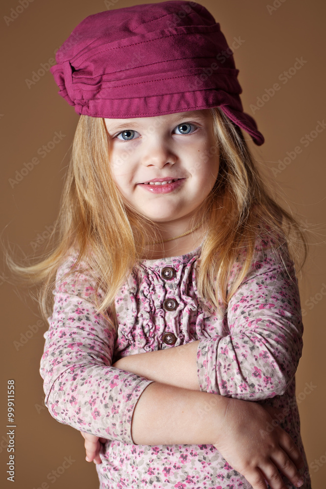 Happy smiling little girl in a cap Happy smiling little girl in a cap