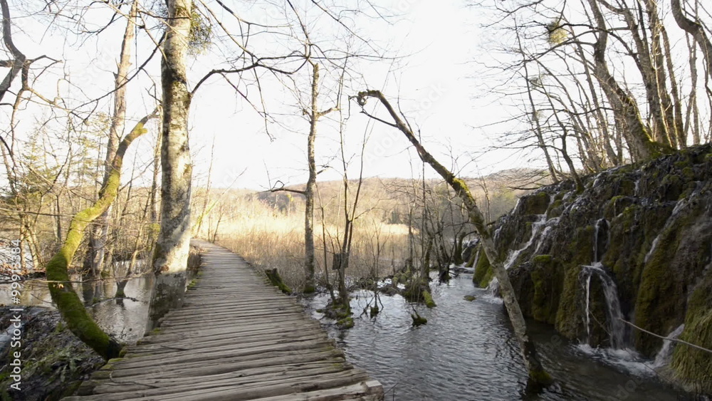 Walking on boarwalk throughout plitvice lakes national park waterfall Walking on boarwalk throughout plitvice lakes national park waterfall