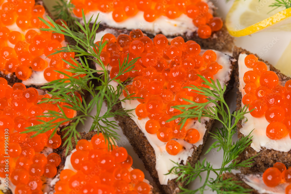 Rye bread with butter and red caviar. Rye bread with butter and red caviar.