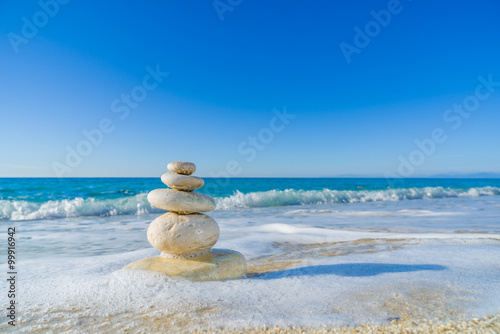 Stones balance  pebbles stack over blue sea in Croatia.