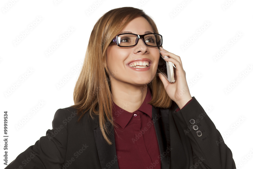 Happy business woman talking on her smartphone Happy business woman talking on her smartphone