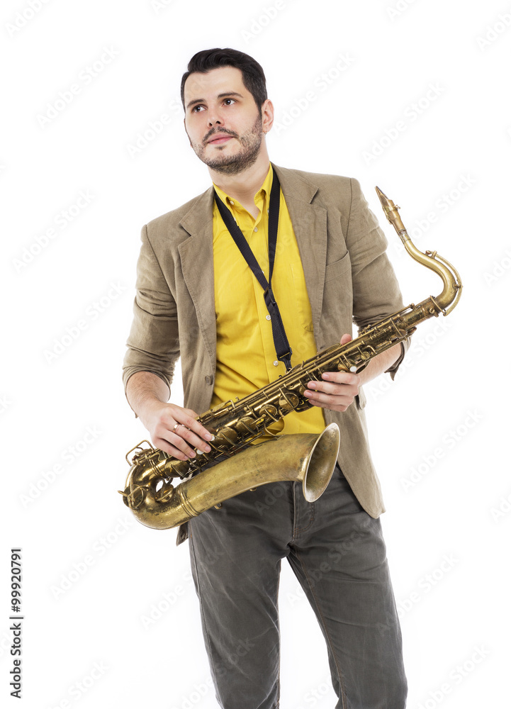 Naklejka premium man saxophonist playing saxophone player in studio isolated on w