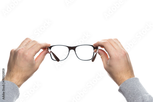 Human hand holding glasses