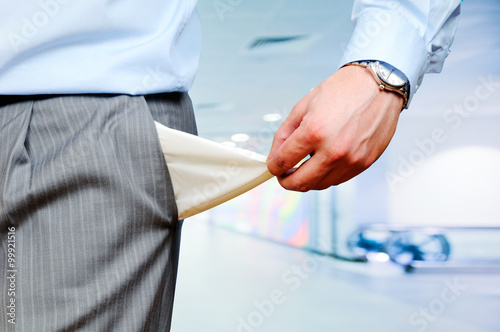 Man pulling out empty pockets