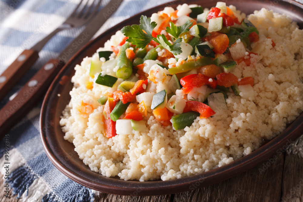 Asian Couscous with vegetables close-up on a plate. horizontal
Asian Couscous with vegetables close-up on a plate. horizontal