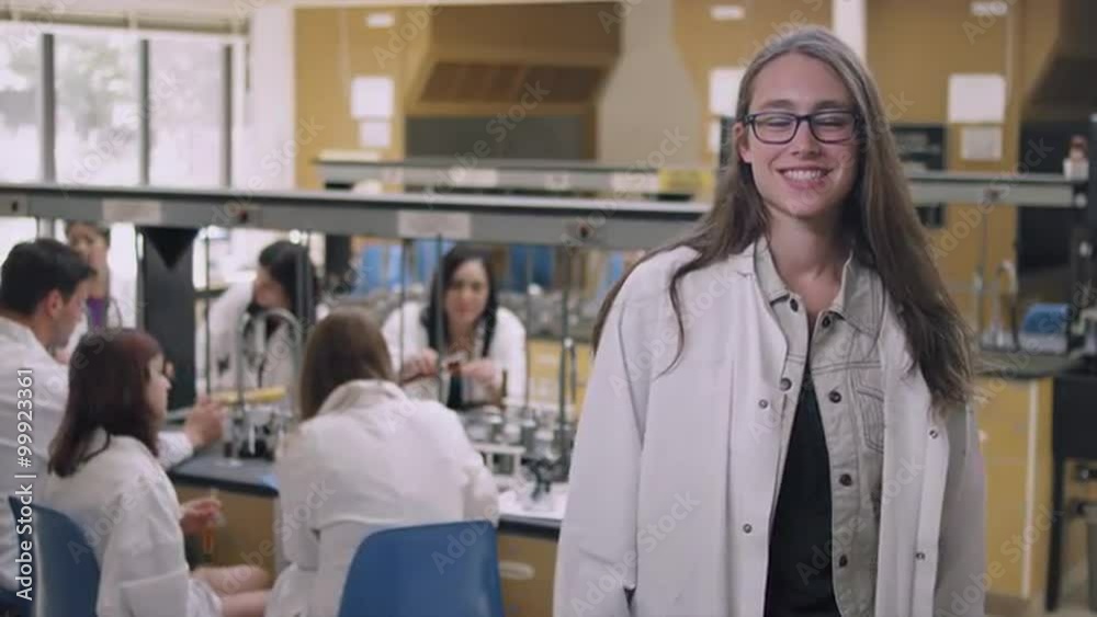 Portrait of a student in a science lab crossing her arms and smiling Portrait of a student in a science lab crossing her arms and smiling