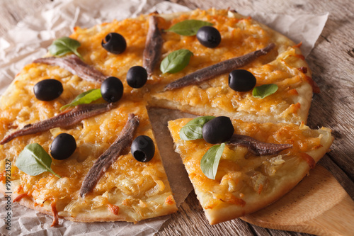 French Pissaladiere with anchovies and onions close-up. horizontal
 photo