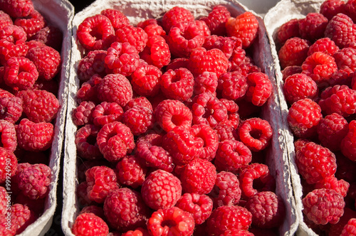 red  raspberries in a paper box