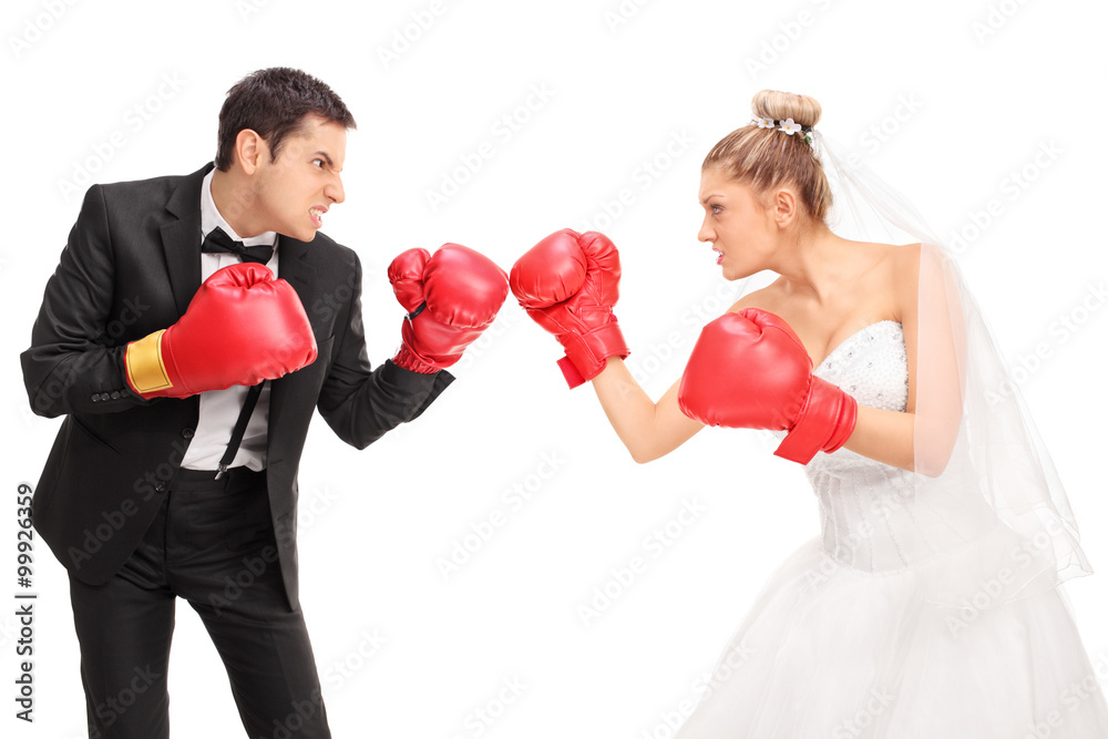Young groom and a bride fighting each other Young groom and a bride fighting each other