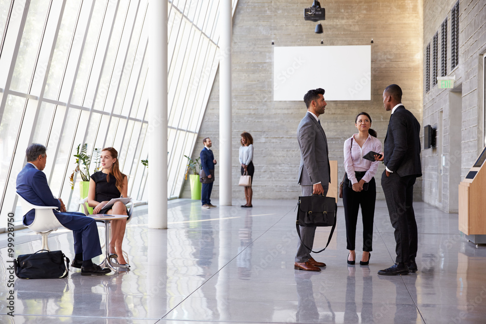 © Monkey Business - Interior Of Busy Office Foyer Area With Businesspeople