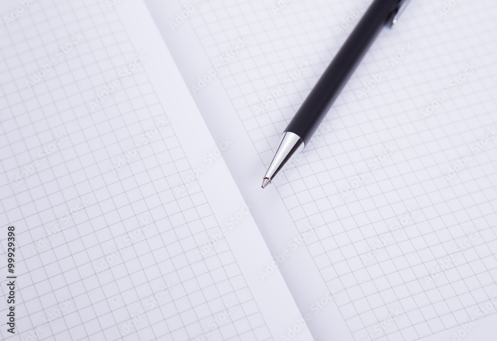 Ball pen and office pad, focus on the tip Ball pen and office pad, focus on the tip