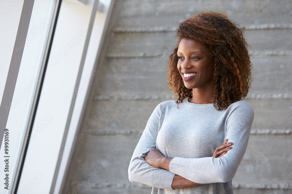 Fototapeta premium African American Businesswoman Standing Against Office Wall