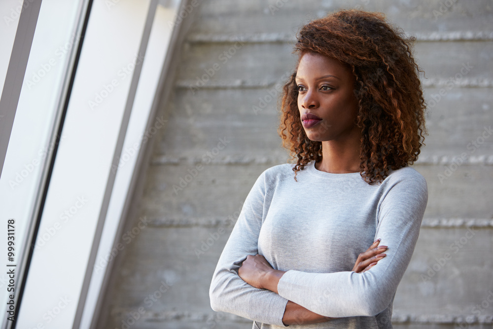 African American Businesswoman Standing Against Office Wall African American Businesswoman Standing Against Office Wall