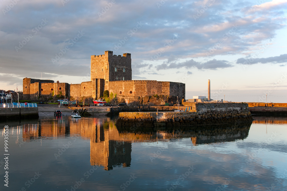 Fototapeta premium Carrickfergus Castle at sunset. One of the best preserved medieval structures in Northern Ireland