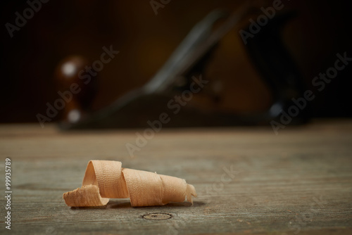 Hand plane on a wooden workbench.