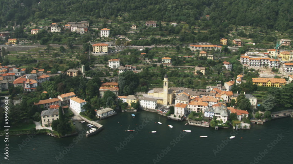 Pan of the shoreline of Lake Como in Italy.
