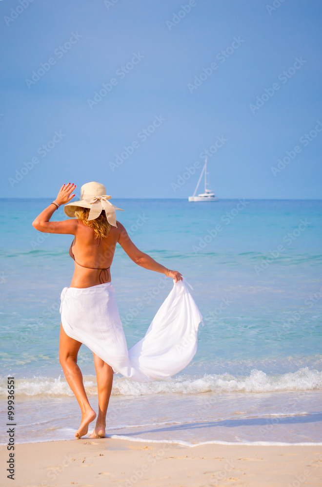 Beautiful Girl With White Scarf on The Beach. Travel and Vacatio Beautiful Girl With White Scarf on The Beach. Travel and Vacatio