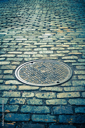 Canvas Print Old cobblestone street with vintage tone filter effect