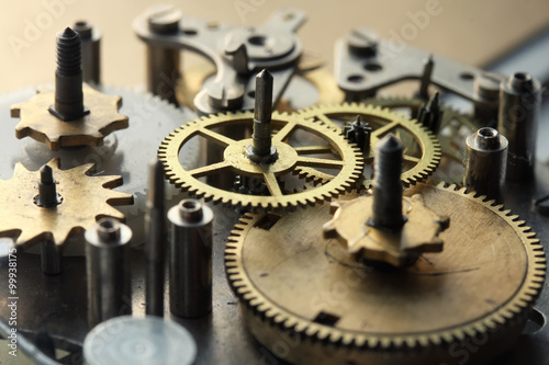 the old clock mechanism with metal gears and screws