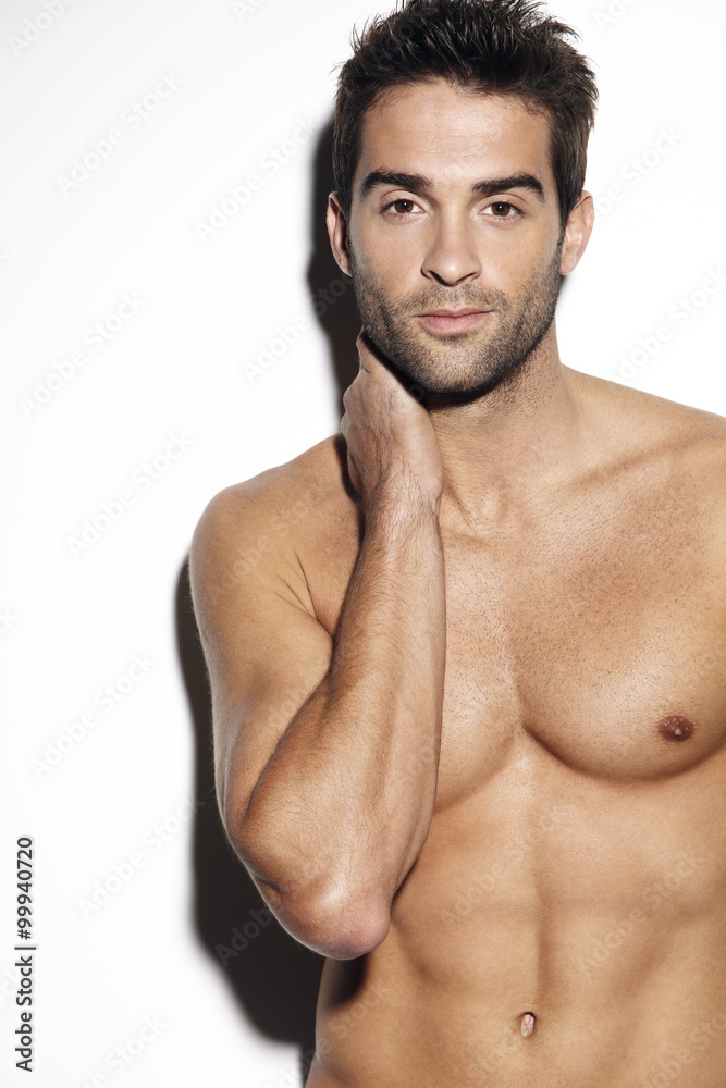 Young muscular man posing in studio Young muscular man posing in studio