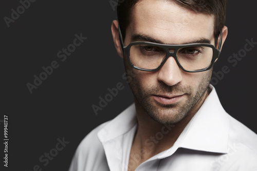 Young man in spectacles looking away © sanneberg