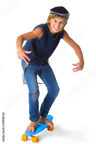 Cute blonde boy or teenager in full length casual style blue jeans posing and showing thumbs up isolated on white