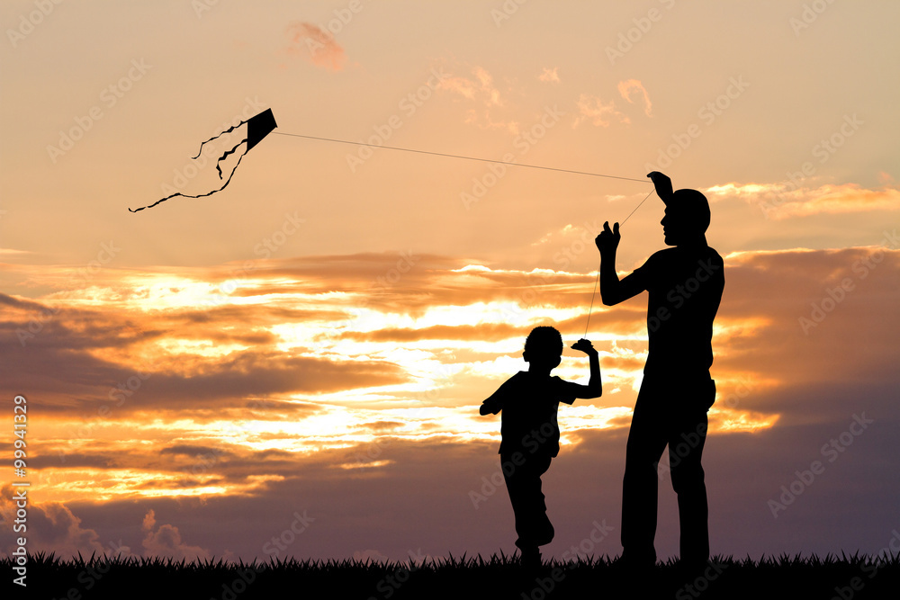 father and child with kite