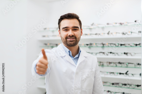 man with glasses and thumbs up at optics store