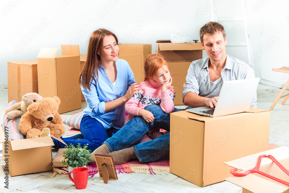 Fototapeta premium The happy family during repair and relocation