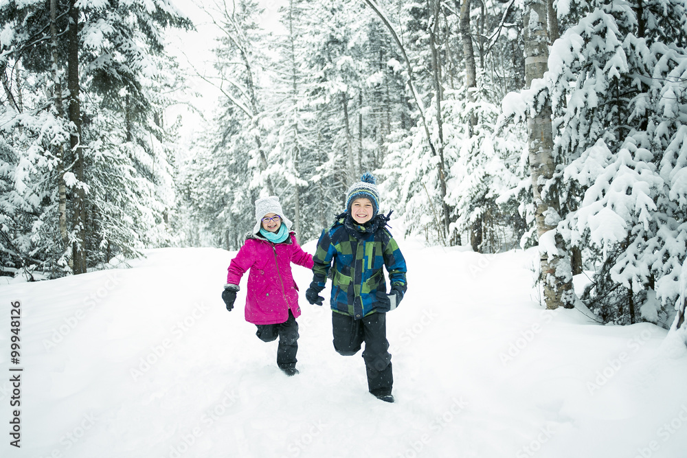 Little girl and boy in winter season