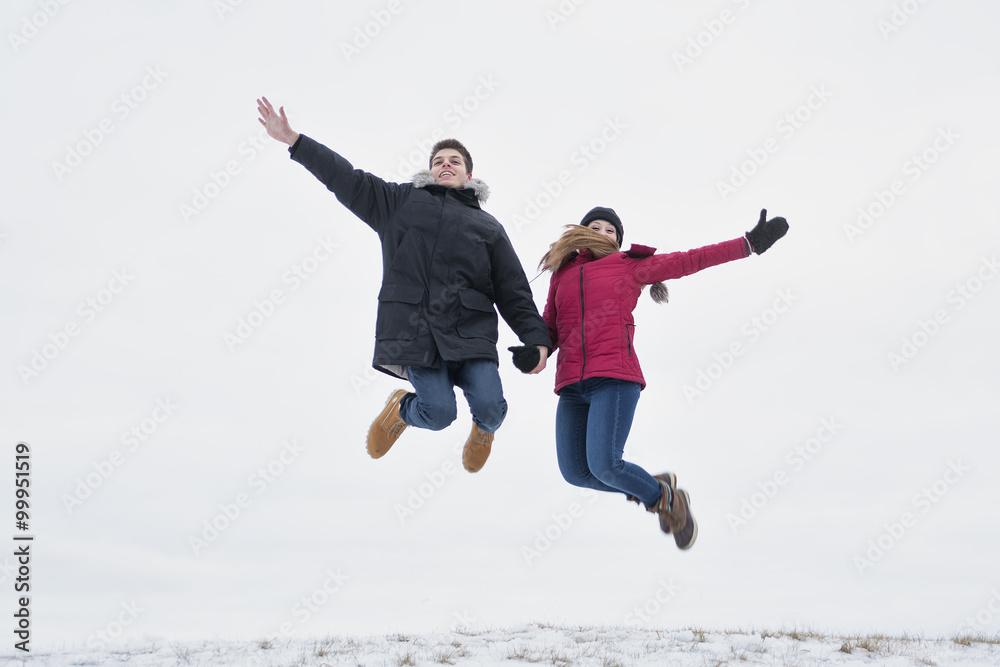 Two teenagers havinf fun on the snow field Two teenagers havinf fun on the snow field