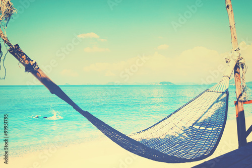 wicker cradle on seascape background, Vacation symbol