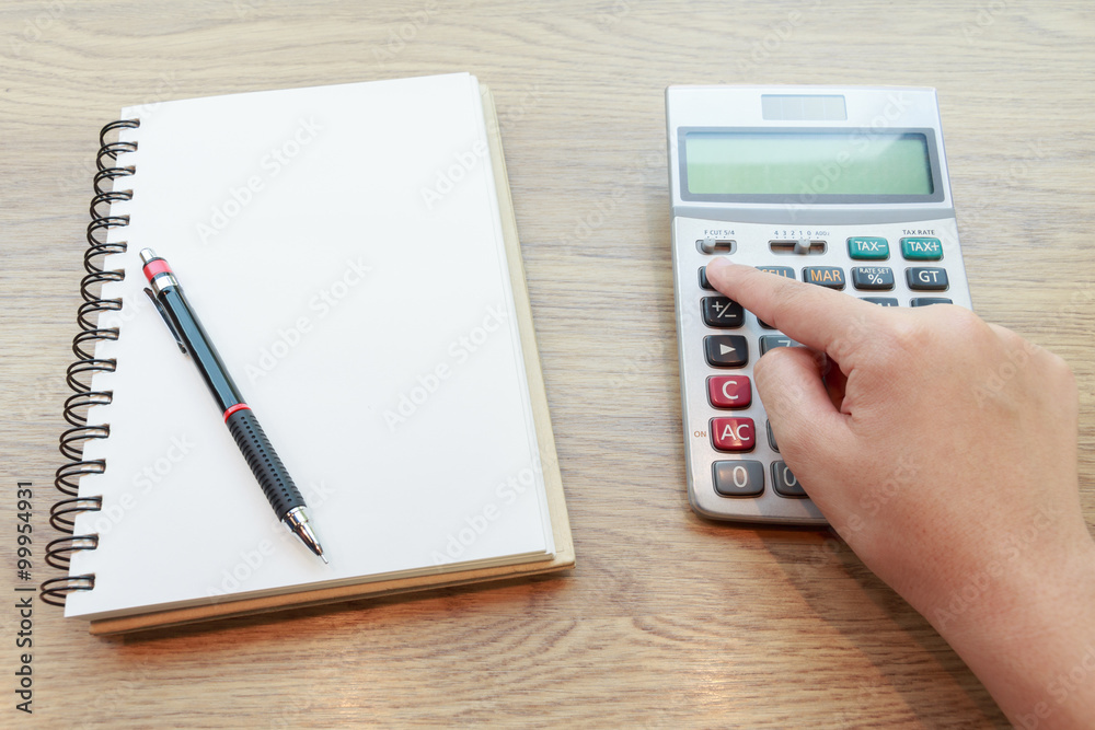 Hands of woman Working with Calculator Hands of woman Working with Calculator