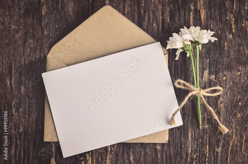 Blank white greeting card with brown envelope