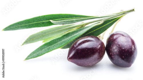 Two fresh olives with leaves on the white background.