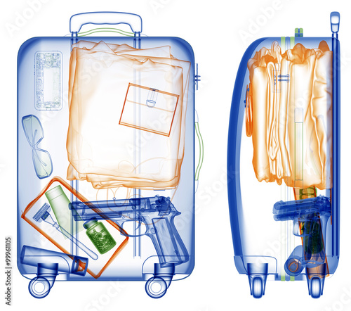 Suitcase with handgun under xray on security control