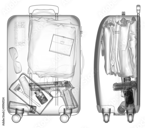 Suitcase with handgun under xray on security control black and white