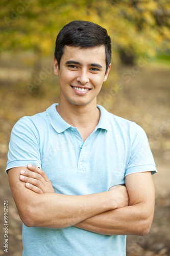 Portrait of Arabic nice man on the background of autumn park