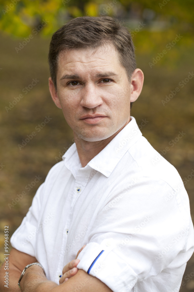Close up portrait of Arabic nice man on the background of autumn park Close up portrait of Arabic nice man on the background of autumn park