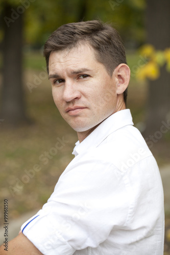 Close up portrait of Arabic nice man on the background of autumn park