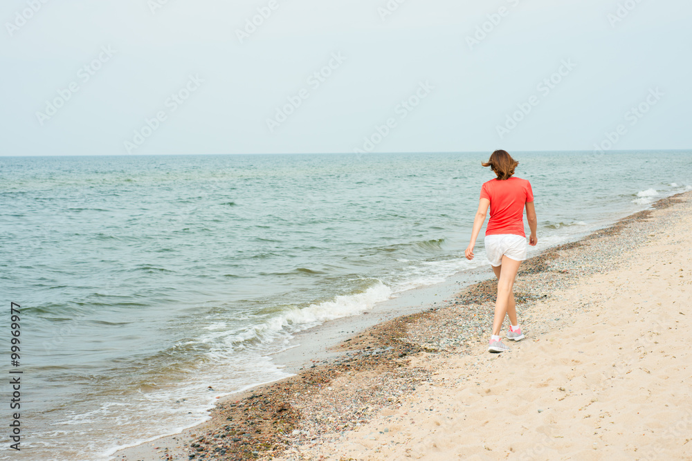 Woman running near the sea
