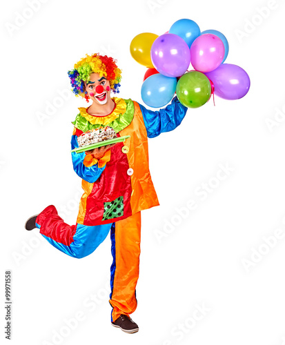 Happy birthday clown man holding a bunch of balloons on Isolated.