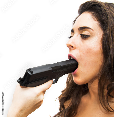 Portrait of Beautiful Young Woman  having a gun in his mouth