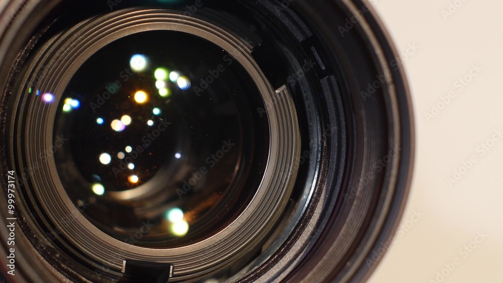 Part of camera zoom lens, glare, close up