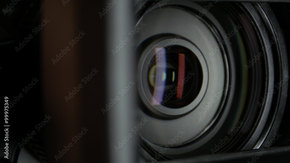 Video camera lens, showing zoom and glare, turns, close up