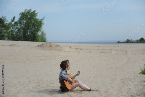 Musician woman and her guitar in good day