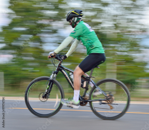 Riding a bike on a street motion blur