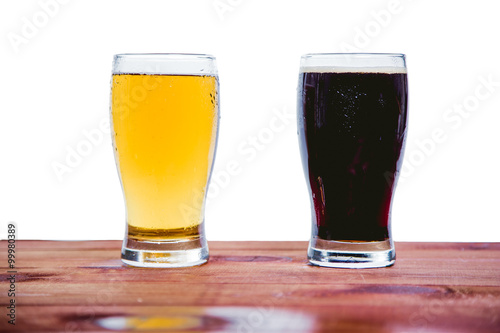 Dark and light beer on the bar on a white background