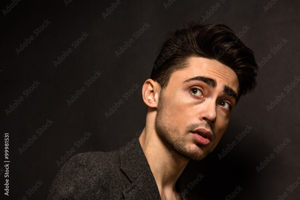 Portrait of model man's face in studio