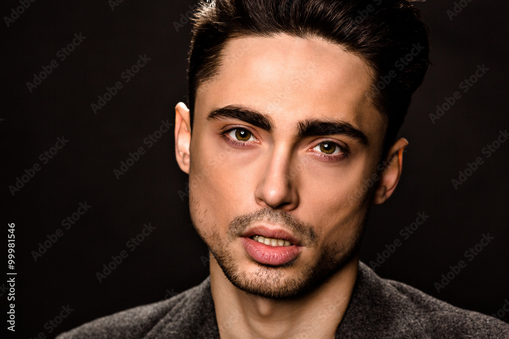 Obraz premium Portrait of model man's face in studio